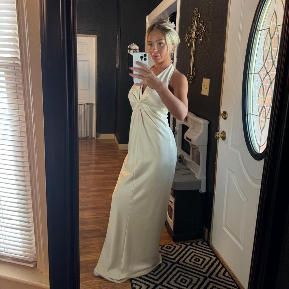 Light yellow maxi dress featuring a dramatic open back